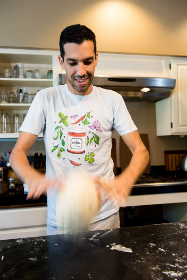 chef kneading bread dough